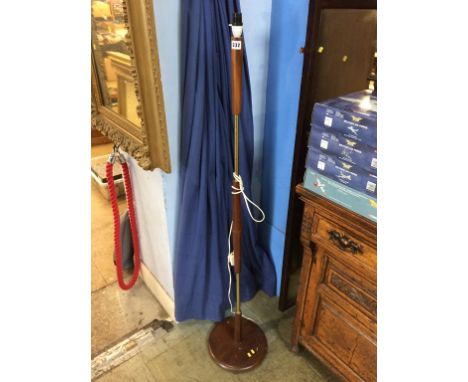 A teak standard lamp