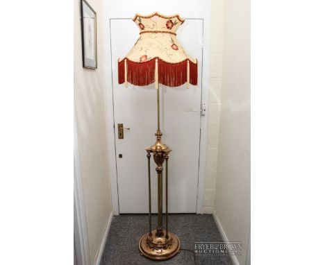 A copper & brass standard lamp, composed of four reeded columns supporting a stiff leaf decorated vase form stem, on stepped 