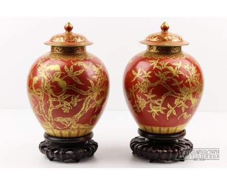 A very fine pair of coral ground gilt decorated Chinese porcelain vases &amp; covers, probably Republic period, each of ovoid