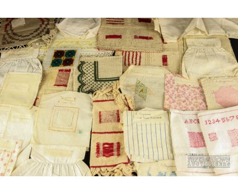 A quantity of needlework school example pieces, first quarter of the 20th century, worked by Florence Benjamin, darning exerc
