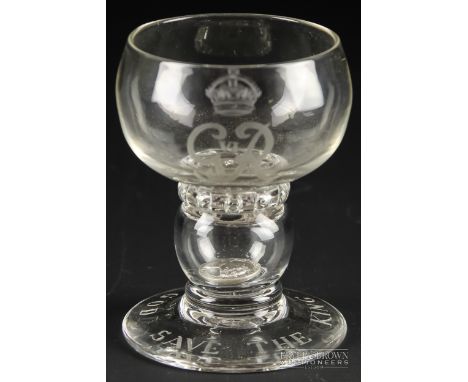 A George VI coin glass, of squat firing glass form with a ring of air inclusions below the bowl, the hollow stem enclosing a 