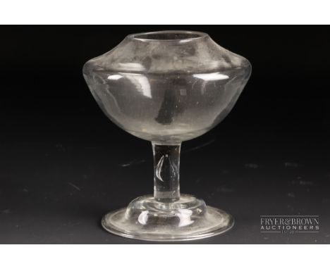 A late 18th century English glass oil lamp, on domed and folded foot, 13cm high 