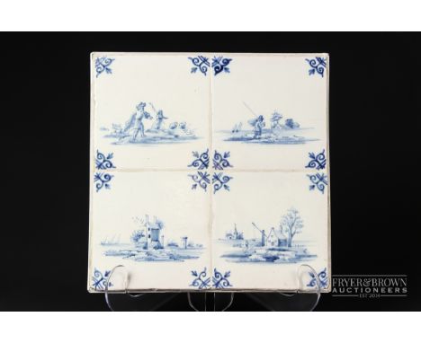 Four Dutch delftware tiles, decorated with scenes of figures and houses, mounted as a panel, 27cm square approx.