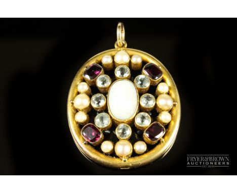 An antique opal, pearl, garnet, gold and aquamarine pendant, c1910, of oval shape set to the centre with a cabochon opal, col