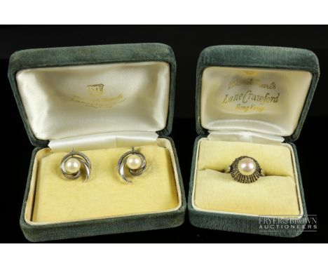 A vintage Mikimoto pair of cultured pearl and silver scroll earrings; and a silver single stone cultured pearl ring (2)