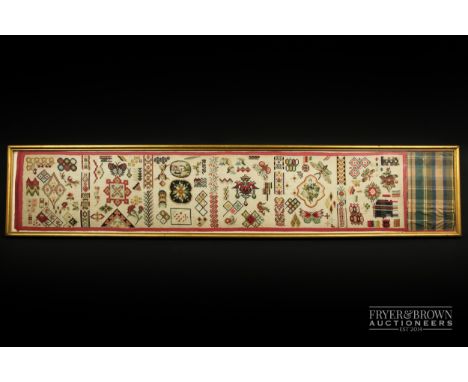 A woolwork pattern roll, 19th century, worked with a diversity of patterns including butterflies and moths, flowers, playing 