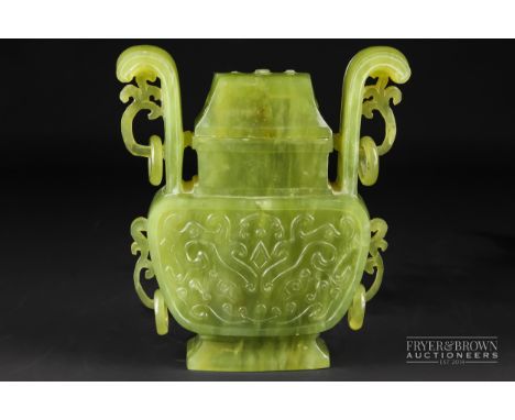 A Chinese carved green jade vase & cover, flattened baluster of rectangular section, the body carved with stylised cloud moti