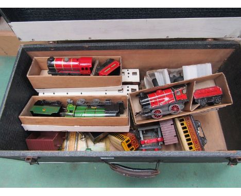 A trunk containing three 0 gauge locomotives, rolling stock etc 