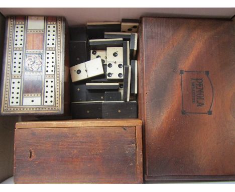 A set of ebony and bone dominoes (28 pieces complete), an inalid cribbage board with markers, cast iron chess set (32 pieces 