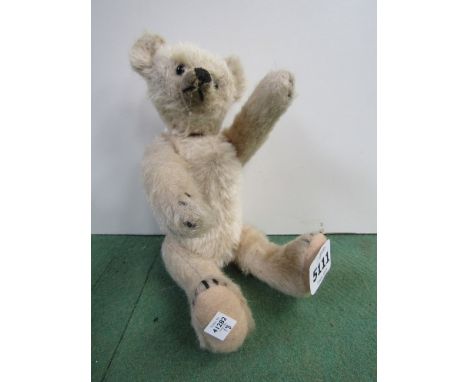 A jointed mohair bear with black button eyes, pronounced snout and humped back, pads replaced.  Approximately 22cm tall, poss