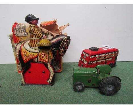 A boxed Wells - Brimtoy mechanical Drummer Boy tinplate toy (box a/f) together with Minic tractor and Wells tinplate bus 