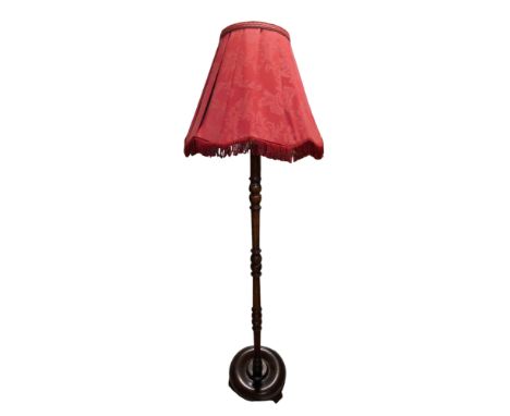 A mid-to-late 20th Century stained sycamore standard lamp, 146 cm to top of bayonet fitting