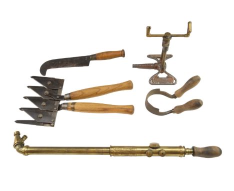 Four vintage garden tools, comprising a 'Rain King' cast iron and brass lawn sprinkler, 'Abol Syringe No 5' garden sprayer,  