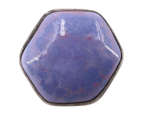 An Art and Crafts Ruskin pottery ceramic and white metal brooch, the hexagonal glazed cabochon bezel set and marked 'Ruskin' 