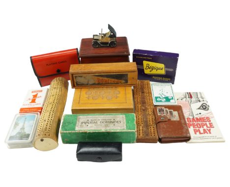 A group of vintage games including an antler cribbage board, Bezique and other playing cards, poker dice etc