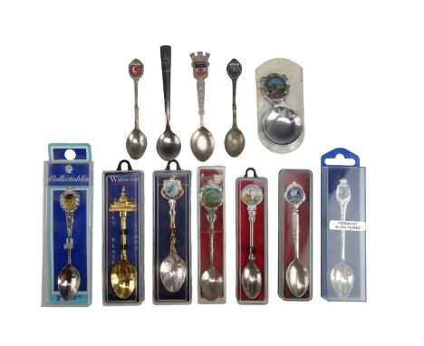 A Ravenglass &amp; Eskdale Railway caddy spoon together with a group of electroplated and stainless steel souvenir teaspoons