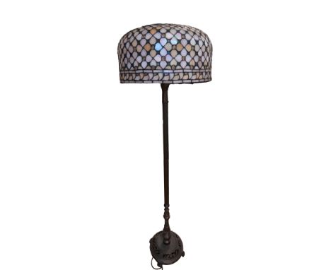 A contemporary patinated brass and leaded glass standard lamp, 158 cm including shade