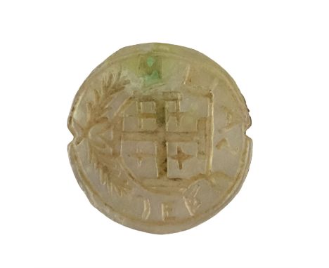 An antique mother-of-pearl seal matrix bearing an engraved Jerusalem cross on a shield with wreath and inscription "Jerusalem