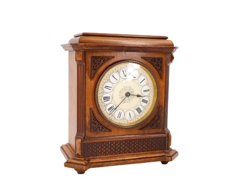 An early 20th Century walnut mantle clock, having a brass drum movement with platform escapement and enamelled dial, 16 x 9 x