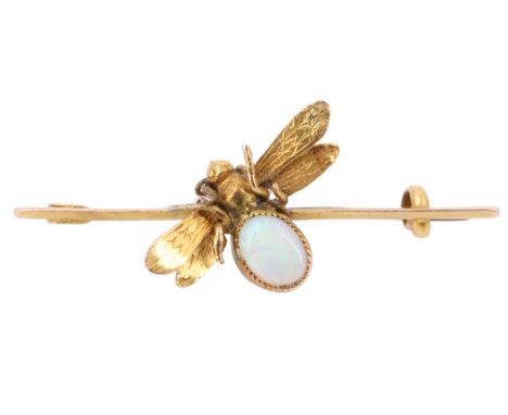 A late 19th / early 20th Century opal and 15 ct yellow metal bug brooch comprising a winged insect with oval opal cabochon ab