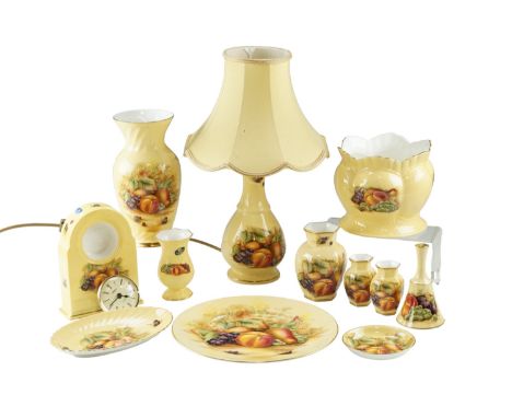 A group of Aynsley Orchard Gold ceramics, including a clock, vases, a cache-pot, a lamp, etc, lamp 27 cm to socket