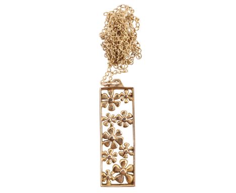 A pierced gold floral pendant necklace, comprising nine random sized daisies scattered within an oblong openwork 9 ct frame, 