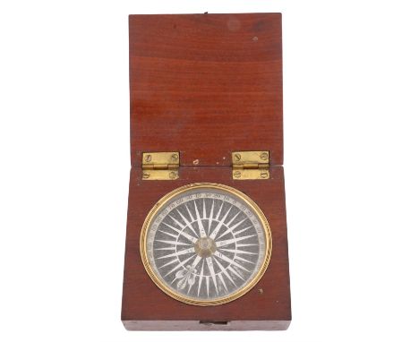 A Georgian pocket magnetic compass, having a printed paper rose and brass-mounted mahogany case, 8 cm x 8 cm x 3 cm