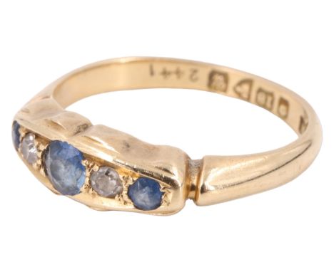 A George V sapphire and diamond finger ring, having a central 3 mm sapphire between two eight cut diamonds and flanked by two