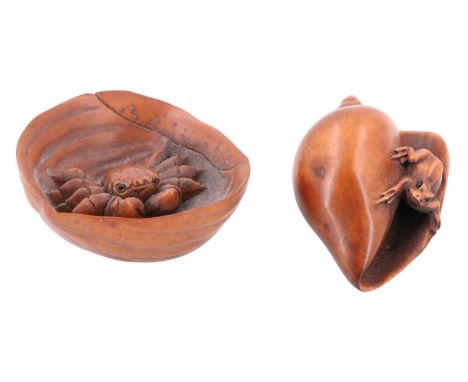 Two late 20th Century Japanese carved wood netsuke, comprising a crab in a walnut half-shell and a frog on a gastropod shell,
