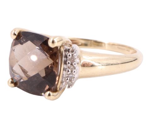 A contemporary smoky quartz and white stone dress ring, having a 10 x 10 mm cushion cut on a four prong open gallery flanked 