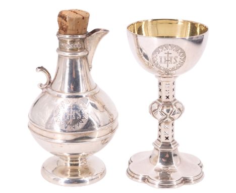 A Victorian travelling communion set, comprising a gilt lined chalice, having a pierced hexagonal section stem, and a wine fl