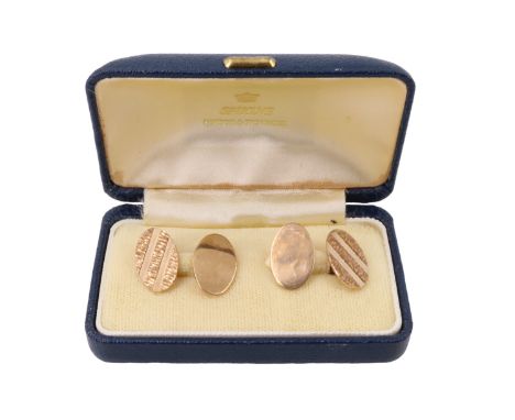 A pair of 9 ct gold oval cufflinks, the fronts of each having bark textured bands, 1975, 6.7 g