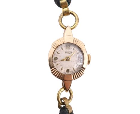 A lady's 9 ct gold Tissot wristlet watch, having a crown wound 15 jewel movement with a circular face and gilt Arabic numeral