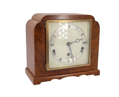 A 1930s Elliot walnut veneered mantle clock having a three train movement striking on rods, 22 cm 