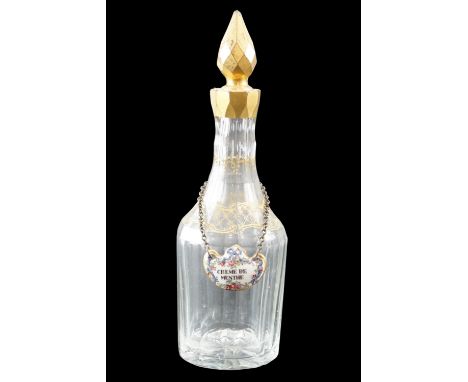 A late 19th Century Palais Royal style facet-cut and gilt enriched creme de menthe decanter with enamelled porcelain bottle t