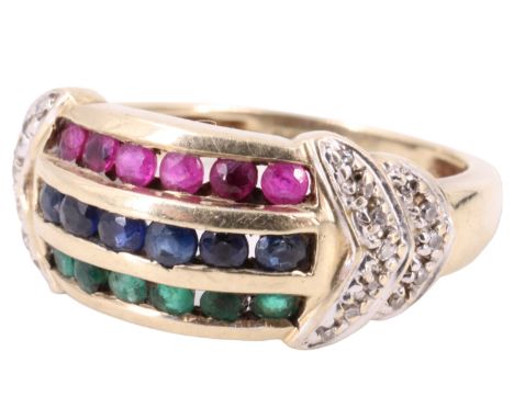 A contemporary ruby, sapphire and emerald dress ring, comprising three parallel rows each of six channel set brilliants, betw