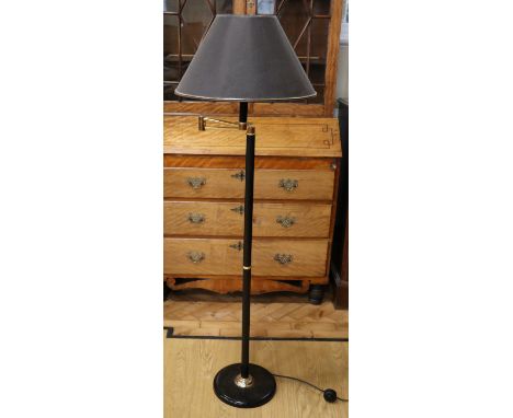 A contemporary gilt and Japanned metal articulated reading lamp, 143 cm including shade