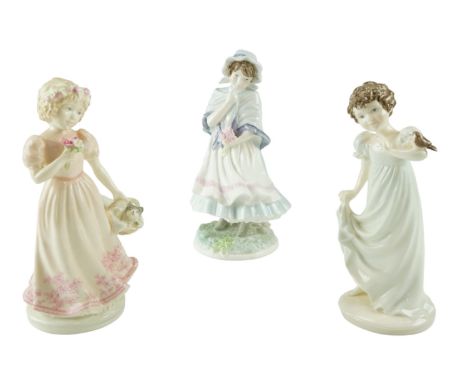 Two Coalport figurines "Innocence" and "A Christmas Kitten" together with a Royal Worcester figurine "A Posy for Mother", 19 