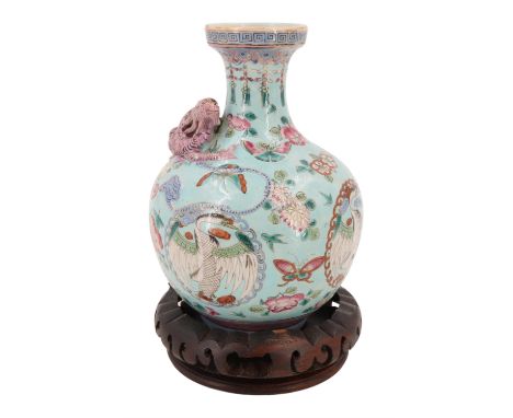 A Chinese blue-ground famille rose bottle vase, decorated with applied three clawed dragon and enamelled birds within medalli