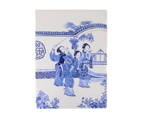 A hand painted Japanese blue-and-white plaque / tile depicting three ladies in a garden setting, 20th Century, 26 cm x 36 cm 