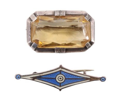An Art Deco citrine brooch,  having a 30 x 16 mm stone set in a canted white metal bezel, and an enamelled brooch, 12.30 g gr