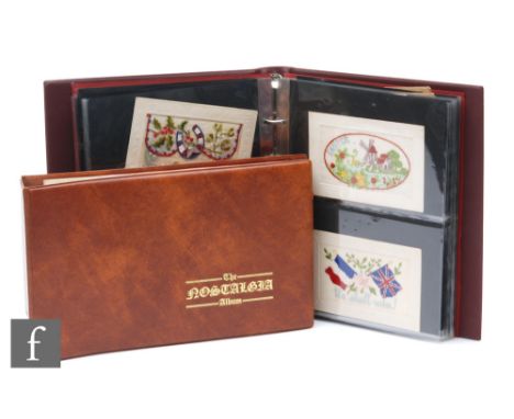 A vinyl album of postcards including a real photographic image of a shop front for F Brooks, also embroidered cards and an al