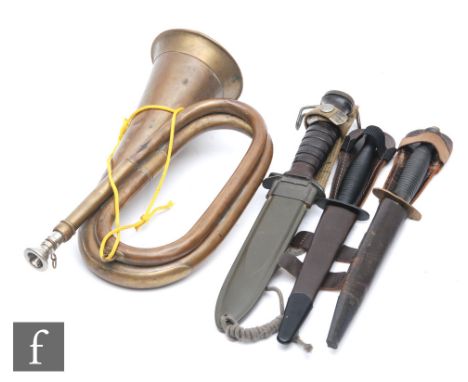 A US dagger and scabbard, the 16.5cm blade stamped US M3 1943, a Sykes style dagger, a Sykes patent three dagger and a brass 