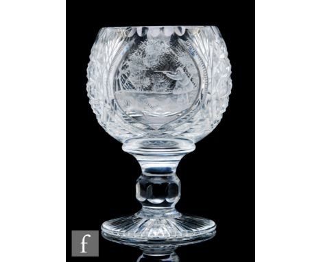 A late 20th Century Stourbridge clear cut crystal glass goblet, the ovoid bowl with a central oval cartouche panel engraved b