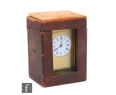 An early 20th Century French brass carriage clock, circular white enamelled dial, the top stamped ‘Olive’, in carrying case, 