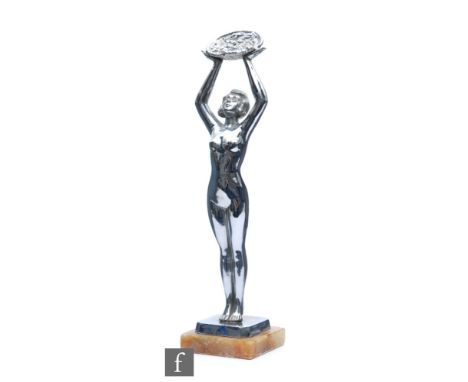 A chrome Art Deco figure of a scantily clad female figure, with arms raised holding a basket of flowers, signed Limousine on 