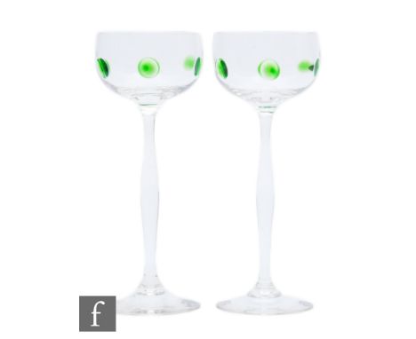 A pair of early 20th Century Art Nouveau drinking glasses by Theresienthal, the shallow ovoid bowls decorated with applied gr