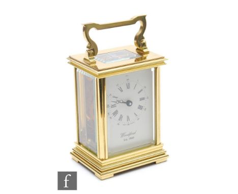 A 20th Century brass carriage clock, the white dial signed Woodford, height 12cm. 