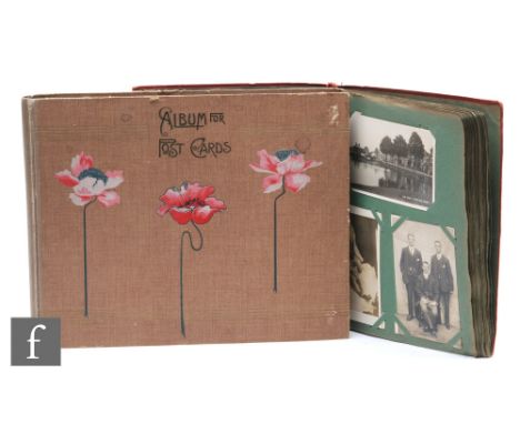 An Edwardian album of postcards with real photographic cards including Omnibus for Golden Hotel with bystanders, J Gould coff