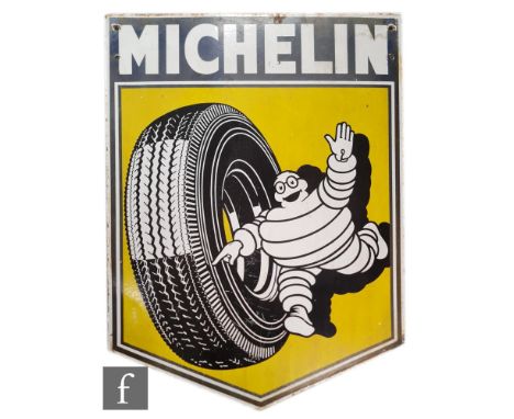 A large double sided enamel pictorial advertising sign for Michelin with white lettering on blue with Bibendum and a tyre to 